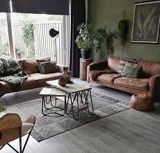 Filled with rich but muted earthy pigments such as soft teal and burnt sienna, this living room offers up ample color without deviating from the neutral color scheme. Modern Earthy Living Room Ideas Novocom Top