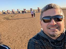 Cadillac Ranch, built in 1974 outside Amarillo, is a row of ten Cadillacs  buried nose-first in the dirt, tailfins sticking up like monuments to  American car culture. Created by the art collective