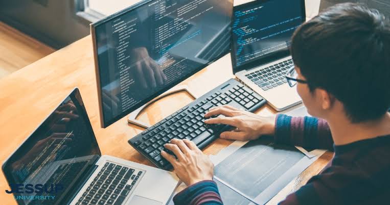 Web developer working on computer
