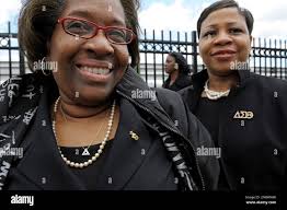 Delta Sigma Theta sorority members Doris Howard of the Washington chapter,  left, and Selena Robinson of the Fairfax County Va. chapter, display their  sorority pins as they arrive for their Omega Omega