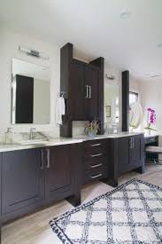 Our amish furniture vanity cabinets are solid wood construction and american start your bathroom renovation with one of our american made bathroom vanities. Master Bath With Dark Vanity Cabinet And Marble Countertop Hgtv