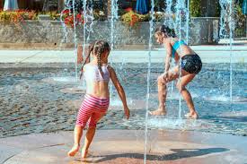 Sit back, relax, and enjoy the peaceful sounds of the patio water fountain as water gently comes of the top bucket, flows into the well, then recirculates back up; Children On A Sunny Warm Day Playing Outside In A Water Fountain Stock Photo Picture And Royalty Free Image Image 127749513