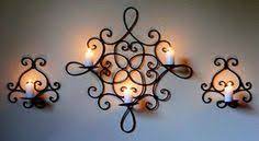 We have a great selection of primitive wrought iron candles holders from which to choose. 14 Best Wrought Iron Candle Holders Ideas Wrought Iron Candle Holders Iron Wall Iron Candle Holders