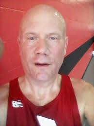 Sporting my Frank Shorter running gear at Salton Sea. My aunt is cold.