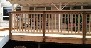 Crisp white posts and classic rails define this handsome, traditional deck rail design. Attach Railing Posts To Outside Less Trimming Of Composite Deck Boards Around The Posts Deck Railings Deck Railing Design Deck Designs Backyard
