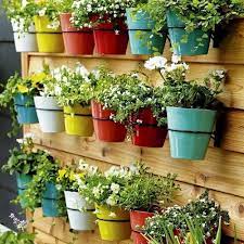 What kind of hook do you use to hang a planter? 18 Space Saving Balcony Hanging Planter Ideas Balcony Garden Web