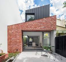 The higher cost and poor insulation. Glebe Red Brick House Modern Patio Sydney Von Hispec Constructions