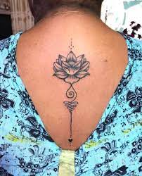 These Lotus Flower Tattoos Will Help You Find Inner Peace In 2021 Lotus Flower Tattoo Spine Tattoos For Women Flower Tattoo