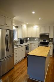 Cabinets · lansing, mi ***lowered price*** wooden corner china cabinet. Starmark Marshmallow Cream Kitchen With Corian Hazelnut Countertops In Lansing Mi Diy Kitchen Remodel Galley Kitchen Remodel Inexpensive Kitchen Remodel