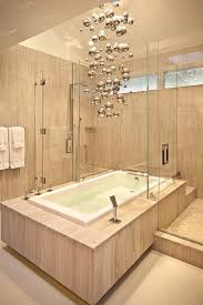 Hanging led lights or panel lights from your transparent ceiling really gives a striking look to the entire area. 25 Sparkling Ways Of Adding A Chandelier To Your Dream Bathroom
