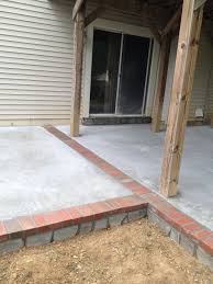 If that is what you have, the i agree with just bill, the best solution, as odious as it sounds, is to rebuild the brick wall. Concrete Patio With Stone Face And Brick Borders In Dale City Va Wright S Concrete