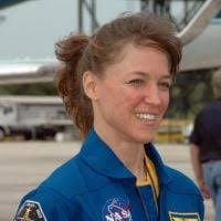 Payload Specialist Taylor Wang performs repairs