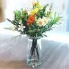 You can easily style a few branches in a vase for a cheerful dining t. 1