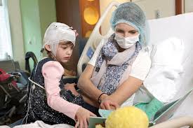 With Weekly Visits for Their 'Brain Juice,' Sisters Annabelle and Abigail  Navigate a Therapy for Batten Disease