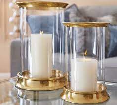 Large metallic gold feather candle holder with hurricane glass. Arlington Hurricane Pottery Barn