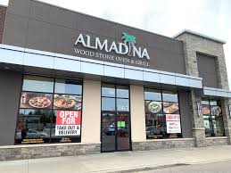 Almadina Restaurant Exterior Coroplast Signs In 2020 Restaurant Exterior Window Graphics Stone Oven