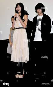 Japanese model Eri Aoki and actor Shota Sometani(R) attend a stage greeting  during an opening day for the horror film "Isn't anyone alive?" in Tokyo,  Japan,