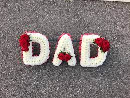 Our red & white sympathy wreath is beautifully arranged with assorted fresh flowers to create a lovely presentation and will display your most heartfelt condolences. Dad Tribute White Based The Biggin Hill Florist Westerham Kent