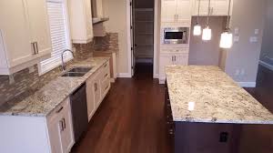 white kitchen cabinets with black