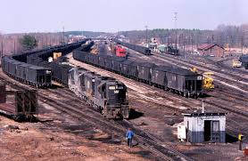 An eastbound Norfolk & Western coal train pulls out of the yard at Crewe,  VA with GP9 #653 and GP18's #2700 and #926. Feb 28, 1977, Stanley Short  Photo.