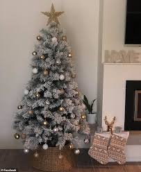 Shop for fake flocked christmas trees online at target. Mum Reveals Her Simple Hack For Creating The Sold Out Target Snowy Aspen Christmas Tree Daily Mail Online