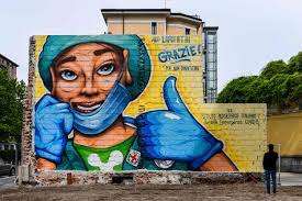 A health care worker in the atlas pose holding up the earth by brigitte dawson and melissa turner of melbourne's murals. Photos Murals And Graffiti Salute Front Line Coronavirus Workers