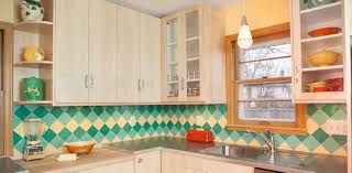 The quartz countertops are in the color frost, sourced from arizona tile. On Pointe Mid Century Modern Kitchen Tile Backsplash