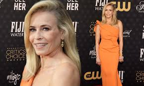 Chelsea Handler dons one-shoulder orange gown