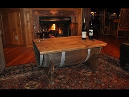List of materials needed whiskey barrel 3/4 self tapping screws 3 1/2 screws barn wood 2x6 or another material you want to build your table legs first i started out by securing the bands around the outside of the barrel to keep the slats from falling apart. How To Build A Whiskey Barrel Coffee Table Youtube