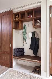 The designers from studio arastu placed these swinging doors in front of a closet to create privacy but also ensure light could still pass through the space. Mudrooms That Really Clean Up Closet Remodel Closet Door Makeover Minimalist Entryway