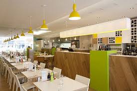 Love How This Counter Combines Wood Planks On The Diagonal With Pops Of Citrus Green Restaurant Restaurant Interior Restaurant Interior Design Cafe Bar Design