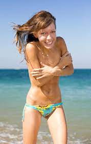 Slim girl on seashore stock photo. Image of topless, laugh - 21922126