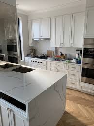 white cabinetry with calacatta quartz