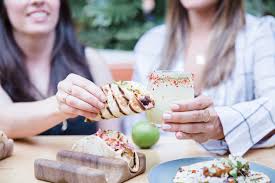 From where and how they're sold, such as out of stalls and carpark trucks; World Taco Day Socal Sydney Socal Sydney