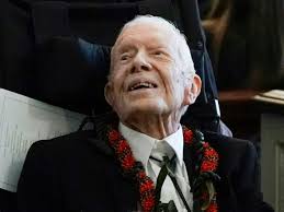 Jimmy Carter holding strong a year into hospice care, family says