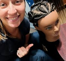 Braider offering hair braiding services