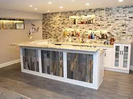 High end wood work makes this man cave bar the ultimate in luxury. Basement Bar Smartland Residential Contractors