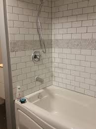 White Subway Tile Bathtub Surround With Marble Hex Tile Ribbon Tile Would Be Nice As Niche Tile Too Bathtub Tile Bathtub Surround Subway Tiles Bathroom