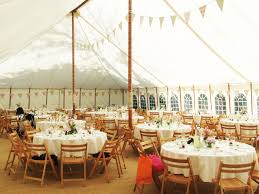 Unlined Marquee With Bunting Wooden Folding Chairs And Peonies Marquee Decoration Secret Garden Wedding Wooden Folding Chairs