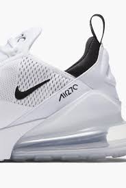 Air max shoes are identified by their midsoles incorporating flexible urethane pouches filled with pressurized gas, visible from the exterior of the shoe and intended to provide cushioning underfoot. Nike Air Nike Ie