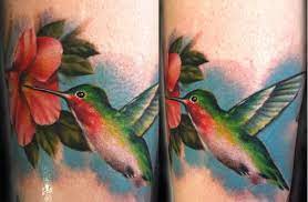 Hummingbird Tattoo L Hummingbird Tattoo Globe Tattoos Girl Leg Tattoos