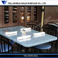 Classy dining room set, featuring a rounded table with a granite tabletop, a beautiful rounded design, and a strong base. Modern Solid Surface Home Furniture Good Quality Artificial Stone Dining Table From China Stonecontact Com