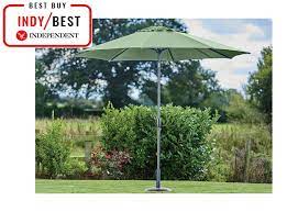 A classic patio umbrella usually has an adjustable pole that goes through the centre of these require a weighted base that is usually bought separately. Best Garden Parasols Freestanding Large And Adjustable Styles The Independent