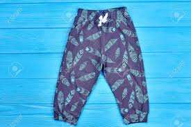 Kids Feather Print Autumn Pants Baby Boy Or Girl Dark Blue Printed Leggings Blue Wooden Background Stylish Childs Wardrobe Stock Photo Picture And Royalty Free Image Image 99513039