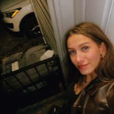 Iwas just trying to get home. Instead, I ended up in a 10-minute standoff  with a man who refused to move his car. Feet out the window, camera in  hand, ego on