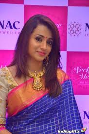 Traditional bridal heavy necklace with lakshmi design , studded with kundans and rubies, paired up with kundan bangles set and jhumkas. Events Trisha Inaugurates Nac Jewellers Necklace Mela Movie Launch And Press Meet Photos Images Gallery Clips And Actors Actress Stills Indiaglitz Com