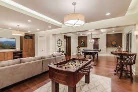 A Rug Was Added Underneath The Foosball Table To Anchor It Keeping It From Looking Adrift In The Large Game Ro Game Room Family Foosball Table Game Room Decor