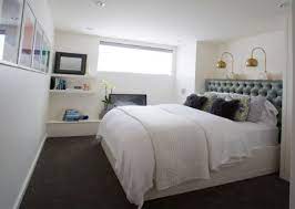 A brighter white paint trim, ceiling, and decor with this blue would make a basement feel crisp and fresh. The Hotel Experience Basement Guest Room Ideas Home Tree Atlas Remodel Bedroom Basement Master Bedroom Small Basement Bedroom