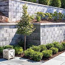 Steps to building a retaining wall with concrete blocks. Garden And Retaining Walls Techo Bloc