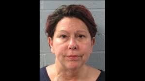 Edmond police: Woman arrested after driving car into a business